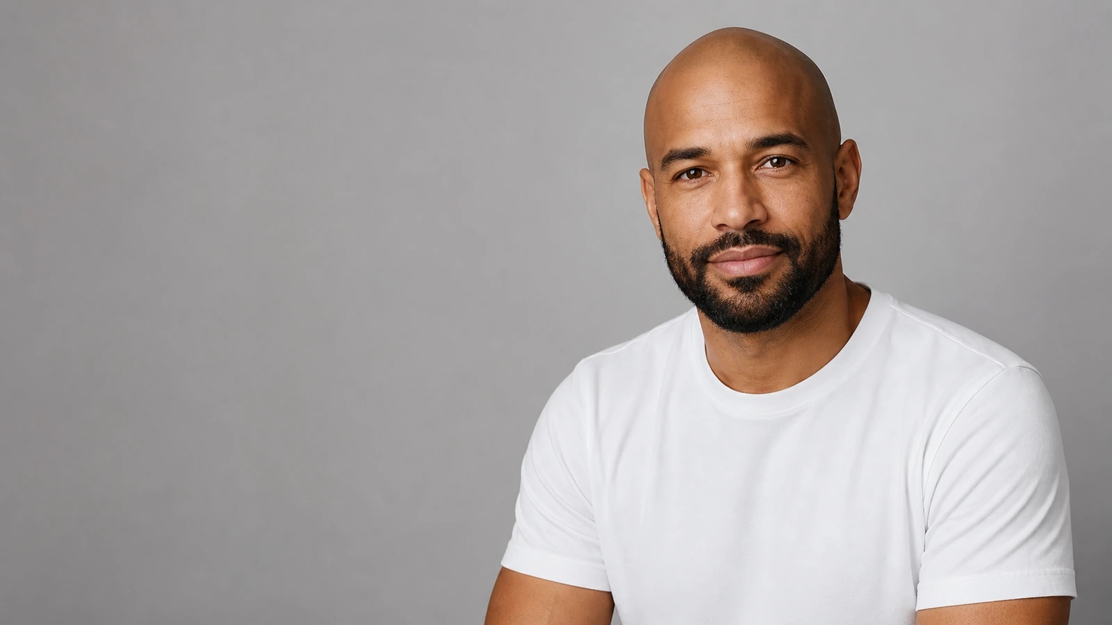 Bald head with short boxed beard balance
