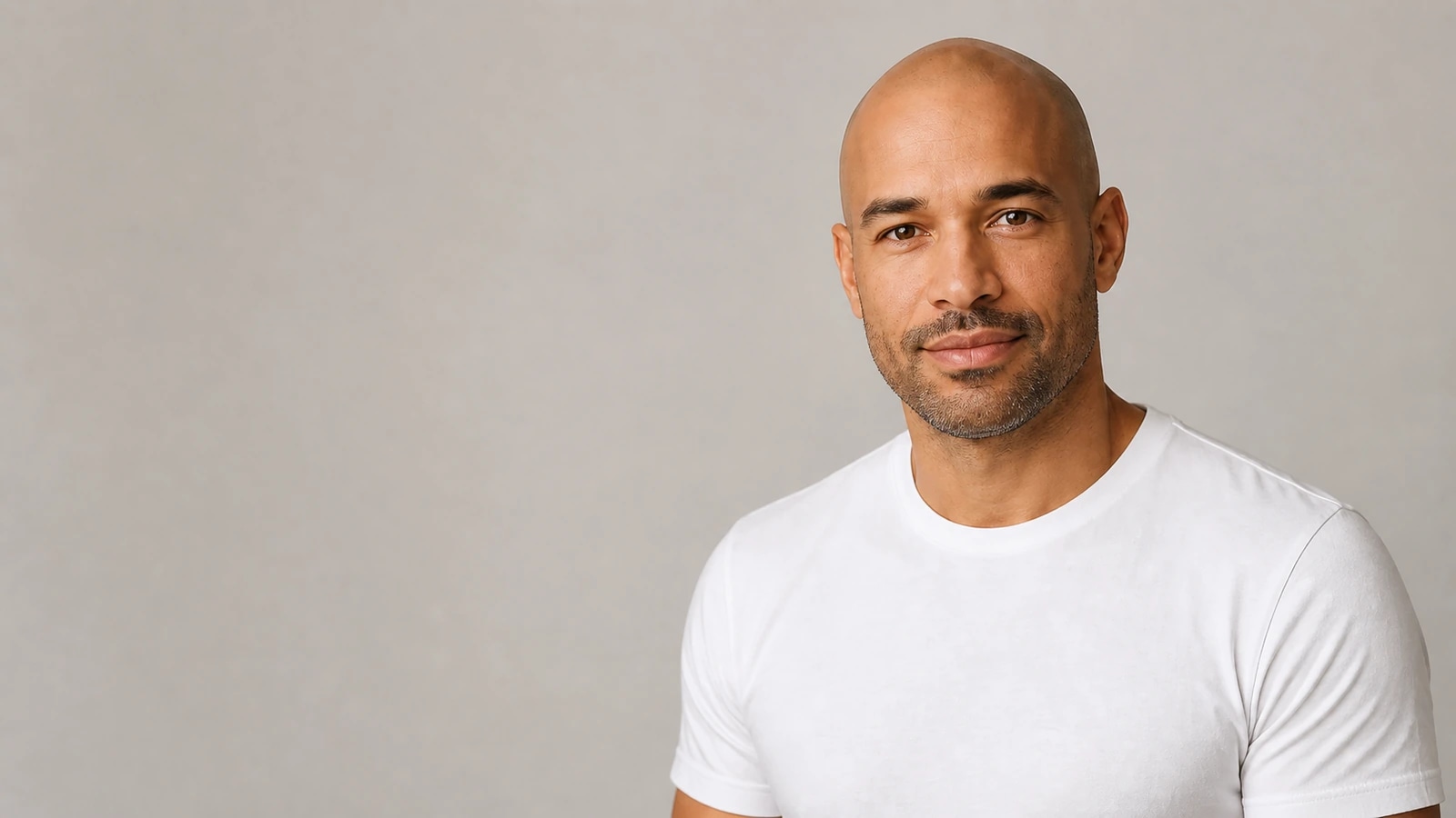 Bald preview with subtle facial hair and confident styling